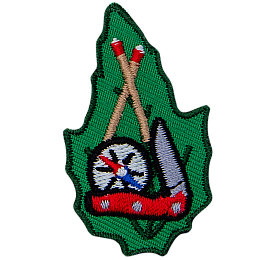This leaf-shaped patch displays (from top to bottom) crossed matched sticks, a compass, and a pocket knife.