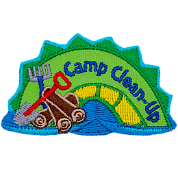 A green and yellow sea serpent with the words Camp Clean-Up on it and a pile of wood, a shove and a rake next to it.