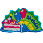 A green and yellow sea serpent hump with the word Birthday on it, and a piece of cake with balloons on the left.