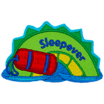A green and yellow sea serpent hump with a rolled-up red sleeping bag and the word Sleepover on it.
