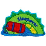 A green and yellow sea serpent hump with a rolled-up red sleeping bag and the word Sleepover on it.