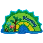 A green and yellow sea serpent hump with the word Planting on the right and blooming flowers on the left.
