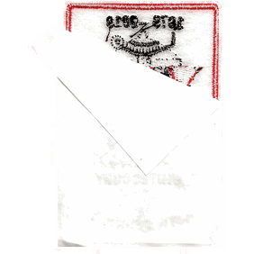 The back of a patch with a sticker sheet partially peeled away.