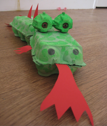 A dragon made from an egg carton.