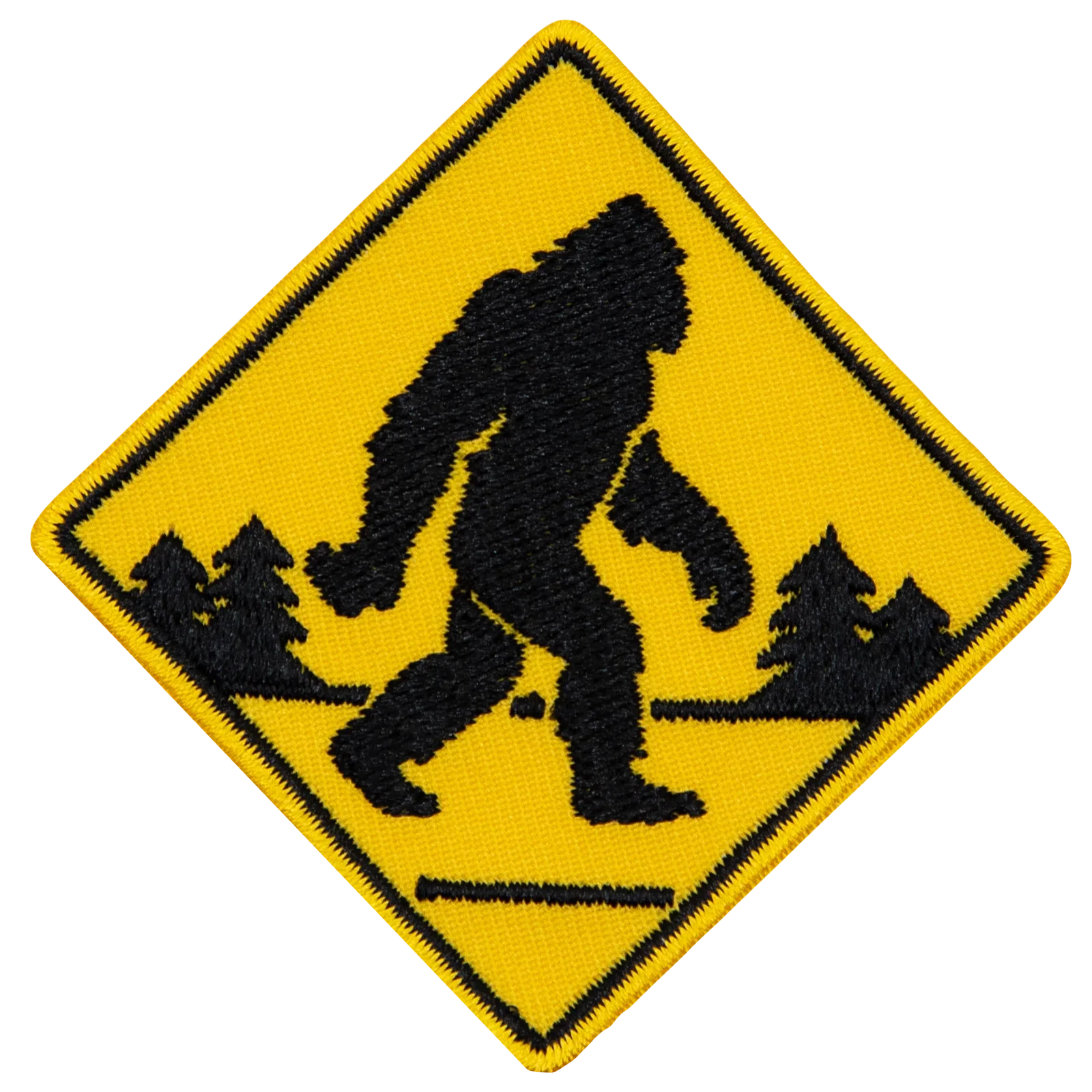A Sasquatch walking across the road.