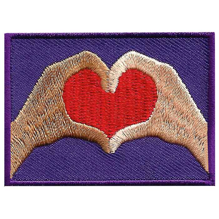 Two hands come together to form a heart.