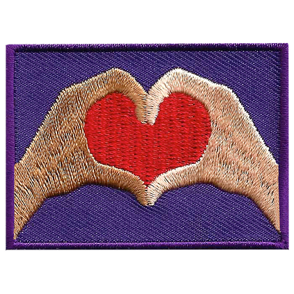 Two hands come together to form a heart.