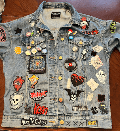 front of a battle jacket with embroidered patches all over