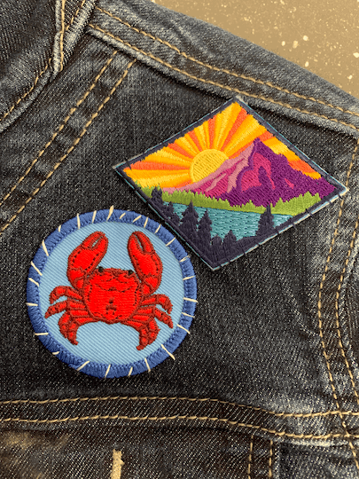 Crab circle badge and Call of the Wild patch
