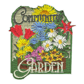 The words Community Garden are surrounded by blossoming flowers.