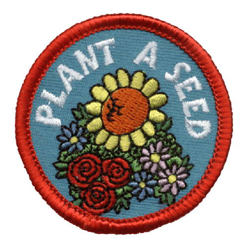 A group of flowers with the words Plant A Seed.